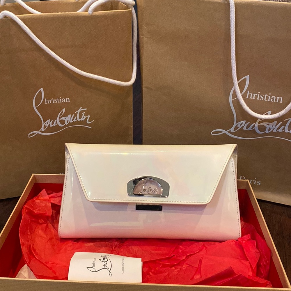 Christian Louboutin white clutch patent.